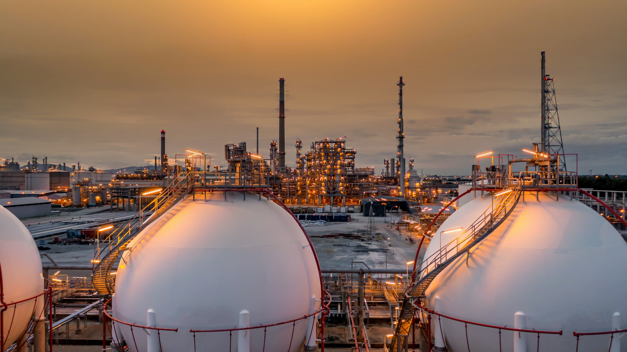 Gas storage sphere tank in petrochemical industry zone with oil and gas refinery factory plant.