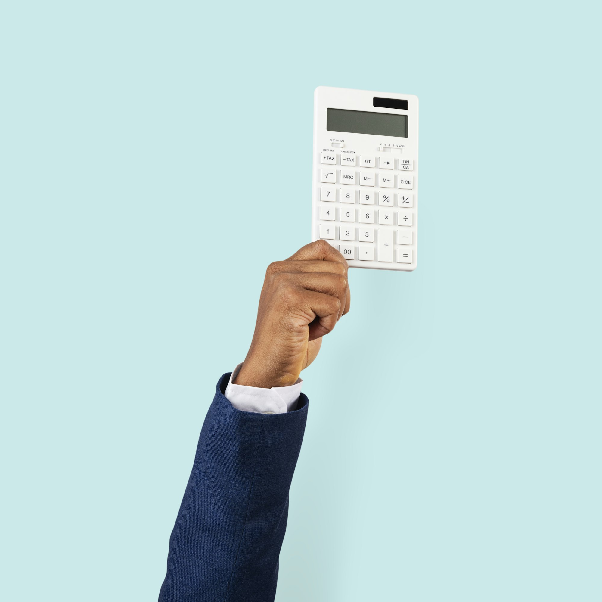 Hand holding calculator in finance concept